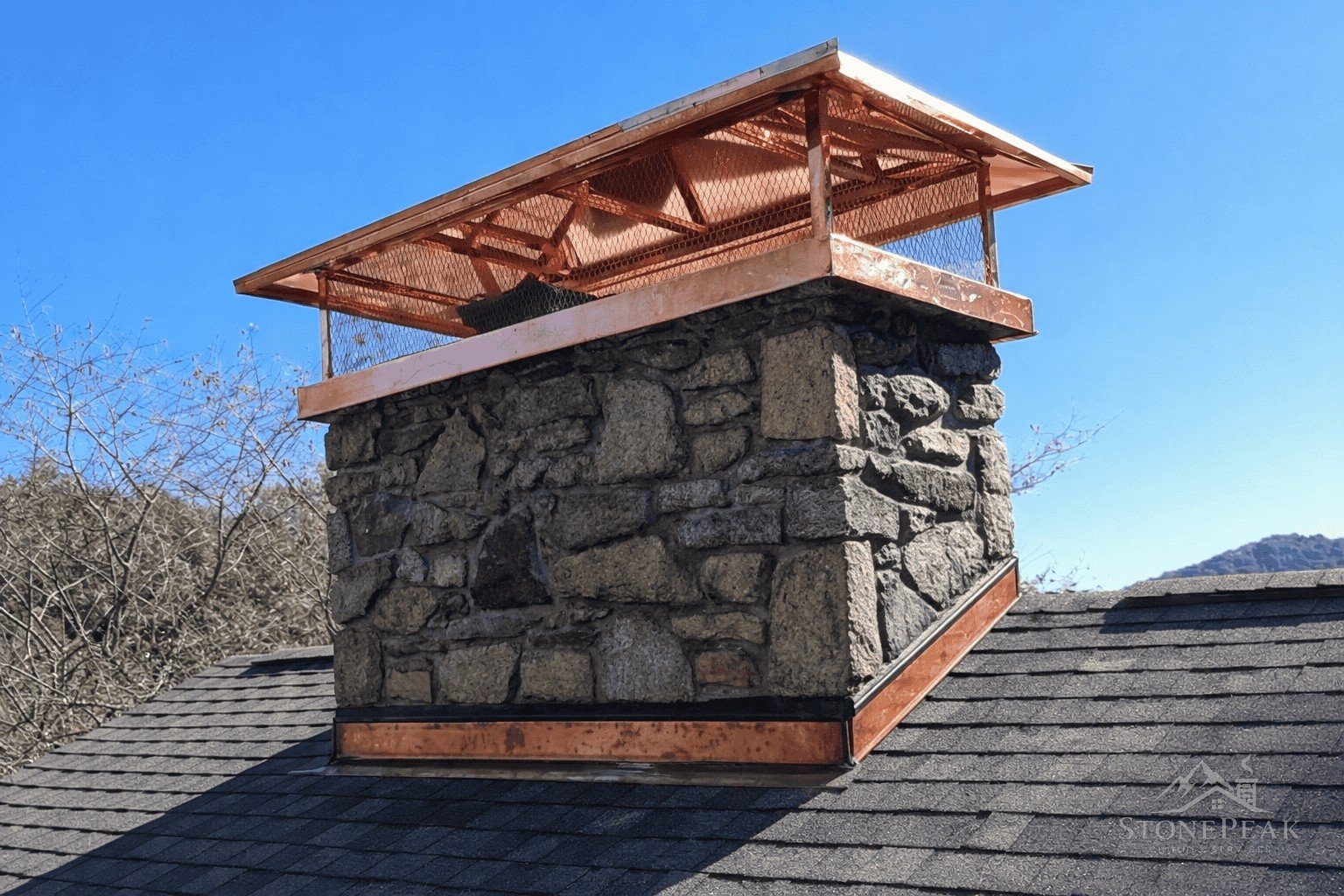 Copper-capped chimney with weatherproofed crown