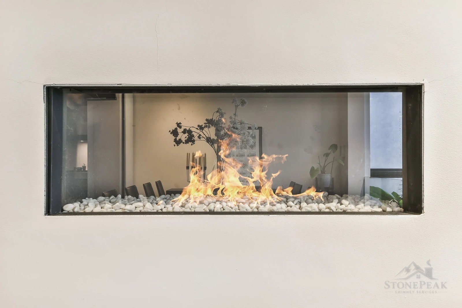 Finished stone fireplace installation with a wood-burning insert